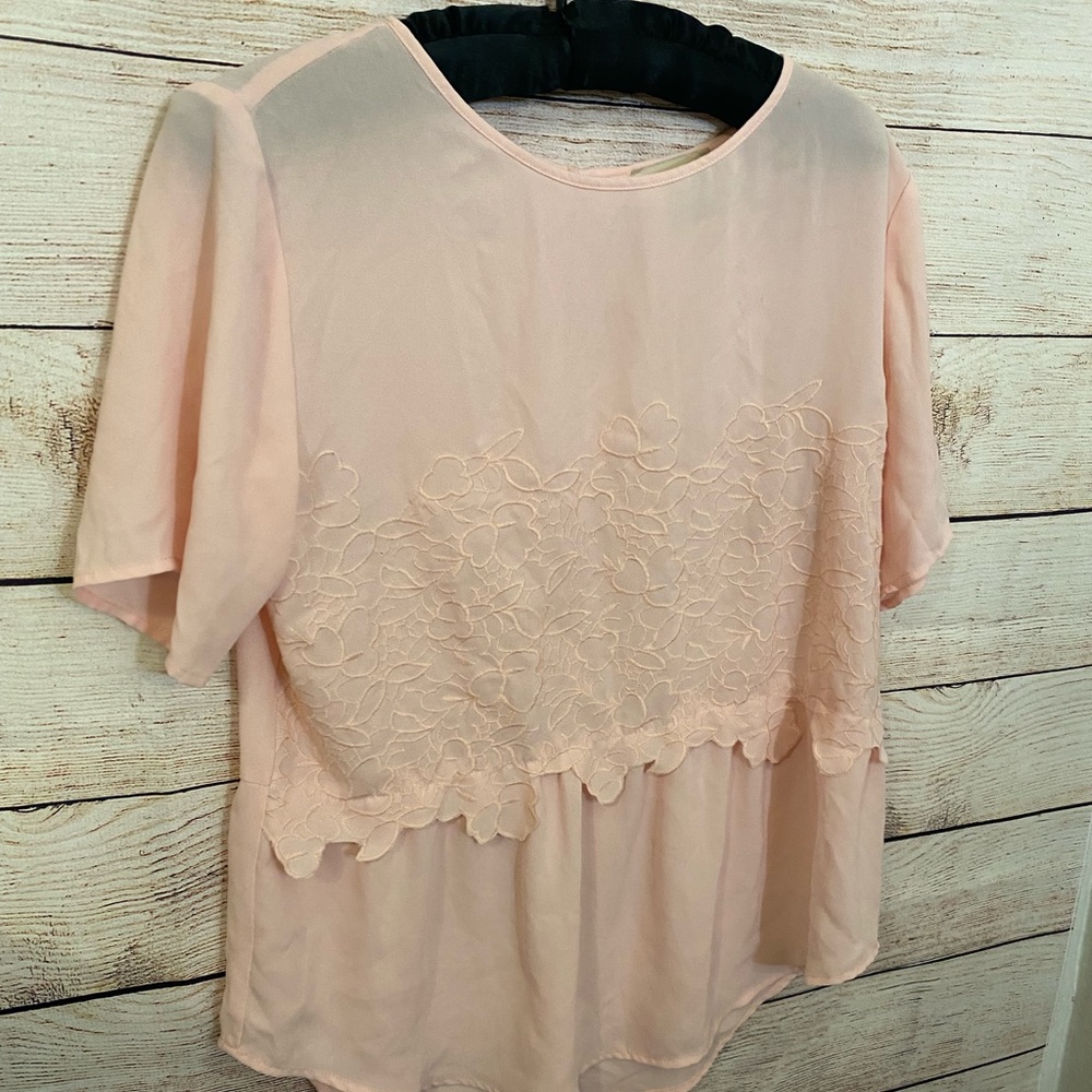 Women’s light pink blouse